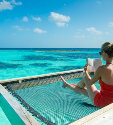 Luxury pool woman with book