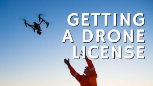 man flying drone blue sky